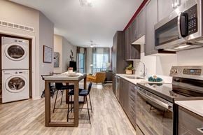 Phoenix apartment for rent - A modern kitchen with a dining table and chairs.