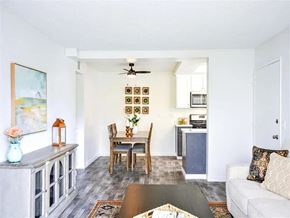 San Bernardino apartment for rent - A living room with a white couch and a coffee table.