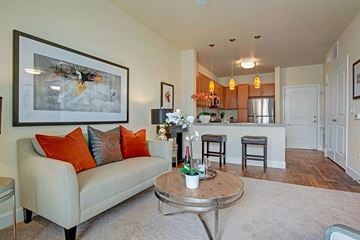Colorado Springs apartment for rent - A living room with a couch, coffee table, and a painting on the wall.
