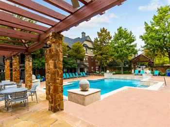 Pool side outdoor seating with fireplace