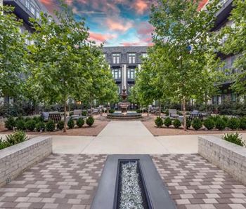 Serene courtyard with spanish fountain and fire table