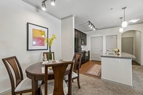 Oklahoma City apartment for rent - A dining room with a table set for two.