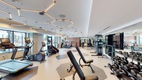 Minneapolis apartment for rent - A gym with treadmills, elliptical machines, and other exercise equipment.
