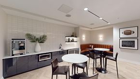 Minneapolis apartment for rent - A modern kitchen with a dining table and chairs.