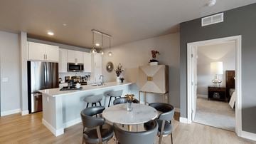 St. Paul apartment for rent - A modern kitchen with a dining table and chairs.
