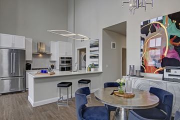Minneapolis apartment for rent - A modern kitchen with a dining table and chairs.