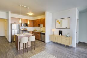 Minneapolis apartment for rent - A modern kitchen with a dining table and chairs.