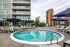 Minneapolis apartment for rent - A round pool with a 4'0" height restriction sign.