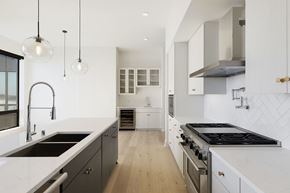 Minneapolis apartment for rent - A modern kitchen with a stove top oven and a sink.