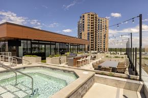 Minneapolis apartment for rent - A modern gym with a glass wall and a television.