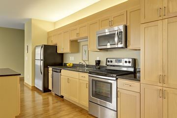 St. Paul apartment for rent - A kitchen with wooden cabinets and stainless steel appliances.