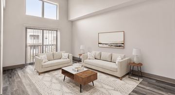 Charlotte apartment for rent - A living room with two couches, a coffee table, and a painting on the wall.