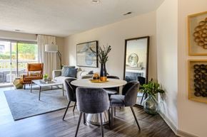 Charlotte apartment for rent - A modern dining room with a round table and grey chairs.
