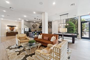 Oklahoma City apartment for rent - A living room with a pool table and a view of the city.