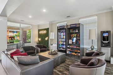 Oklahoma City apartment for rent - A modern living room with a grey couch and a coffee table.