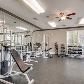 Oklahoma City apartment for rent - A well-equipped gym with a variety of exercise machines and weights.