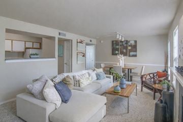 Moore apartment for rent - A living room with a white couch and a coffee table.