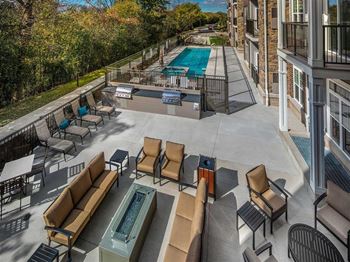 Pool deck with fire pit and 2 summer kitchens
