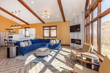 Lehi apartment for rent - A modern living room with a blue sofa and wooden flooring.