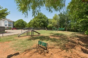 Oklahoma City apartment for rent - A green sign with the number 2 on it sits in the middle of a dirt field.