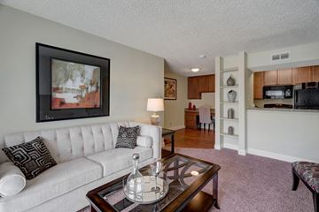 Odessa apartment for rent - A living room with a white couch and a coffee table.