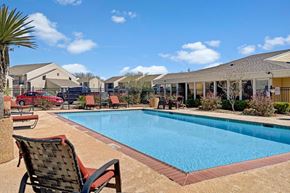 Odessa apartment for rent - A sunny outdoor pool area at Acacia Park featuring a sparkling swimming pool, comfortable lounge seating, open sightlines, and a relaxed community vibe ideal for warm-weather enjoyment.