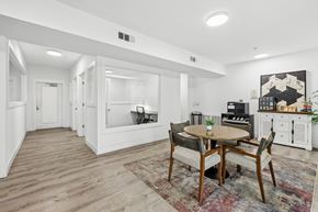 Garland apartment for rent - A dining room with a round table and chairs.