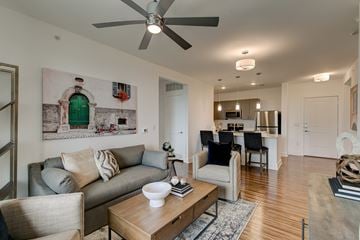 Rockwall apartment for rent - A living room with a grey couch and a coffee table.