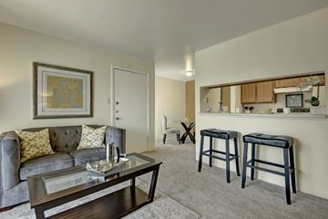 Odessa apartment for rent - A living room with a grey couch and a coffee table.