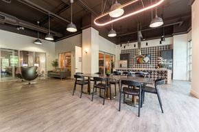 Allen apartment for rent - A modern dining room with a large table and chairs.