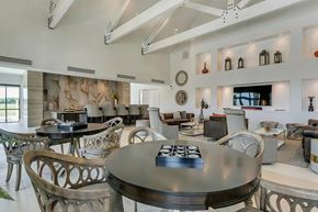 Mckinney apartment for rent - A modern dining room with a large table and chairs.