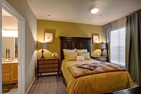 Midland apartment for rent - A bedroom with a bed, nightstands, and a dresser.