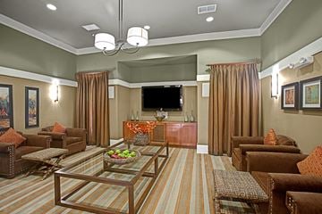 Midland apartment for rent - A living room with brown furniture and a flat screen TV.