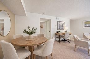 Midland apartment for rent - A dining room with a round table and chairs.