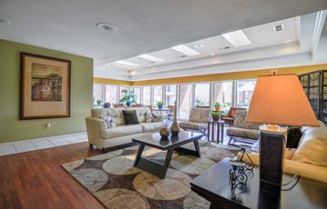 Midland apartment for rent - A living room with a couch, coffee table, and a painting on the wall.
