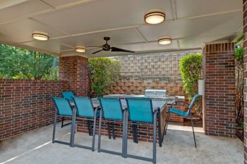 Outdoor cabana with kitchen and gas grill