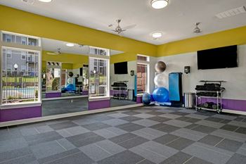 24-Hour fitness center with yoga room