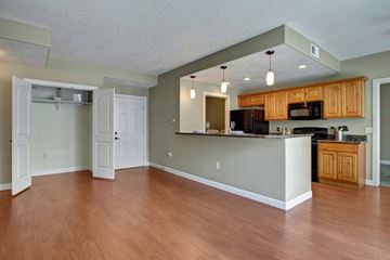 Salt Lake City apartment for rent - A kitchen with wooden cabinets and a white counter.