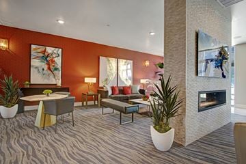 Salt Lake City apartment for rent - A living room with a fireplace and a painting on the wall.