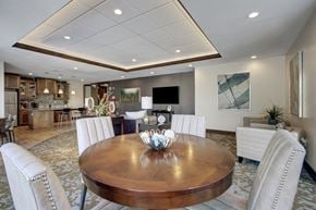 Salt Lake City apartment for rent - A dining room with a wooden table and white chairs.