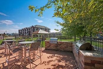 Four outdoor gas grills