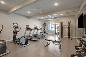 Wenatchee apartment for rent - A fitness center here at 600 Riverside with modern cardio machines, free weights, strength equipment, and bright overhead lighting, creating a clean, spacious, and motivating workout space.
