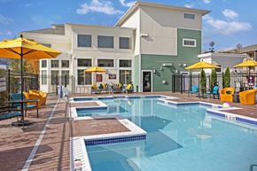 Wenatchee apartment for rent - A large swimming pool with a building in the background.