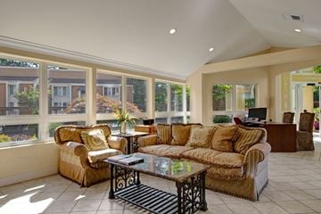 Bellevue apartment for rent - A living room with a large couch and a coffee table.