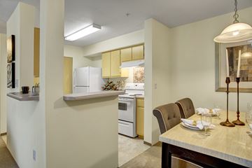 Covington apartment for rent - A kitchen with a dining table set for two.
