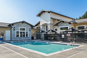 Leavenworth apartment for rent - A house with a pool in front of it.