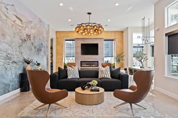 Leavenworth apartment for rent - A living room with a fireplace and a large painting on the wall.