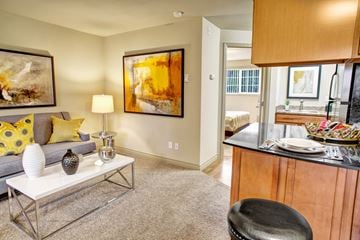 Bellevue apartment for rent - A living room with a grey couch and a white coffee table.