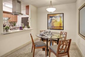 Renton apartment for rent - A dining room with a glass table and chairs.