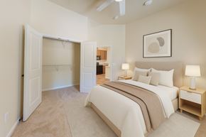 Leavenworth apartment for rent - A bedroom with a large bed and a ceiling fan.